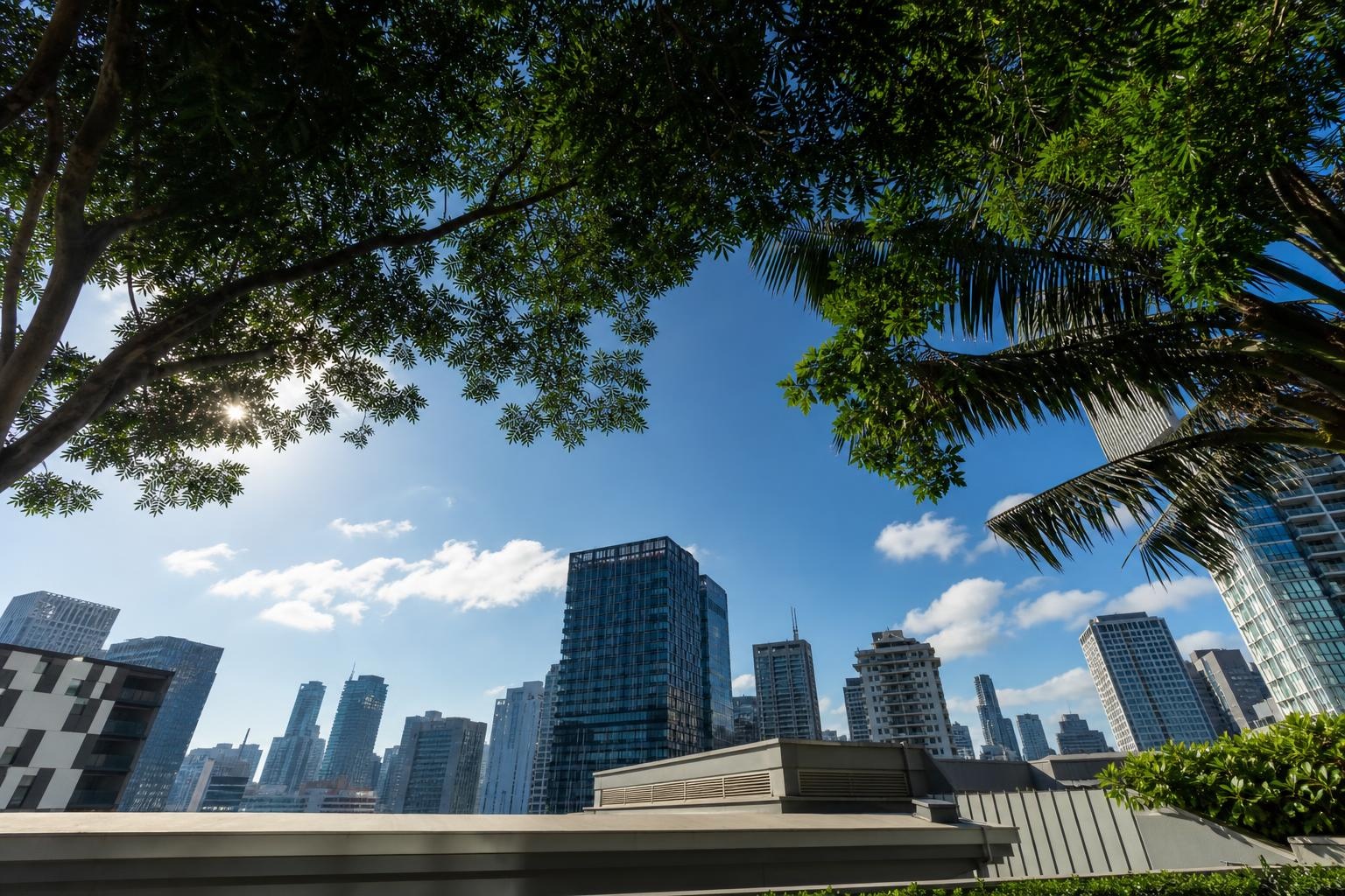 Illustrative view of Singapore high-rise buildings framed by tropical trees under a blue sky.