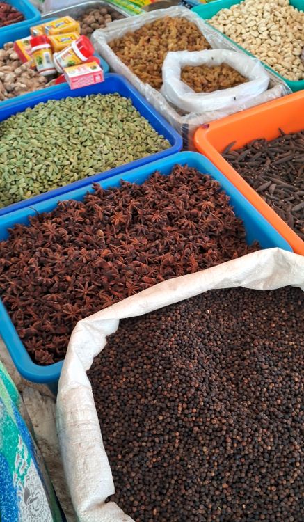 Illustrative close-up of colourful spices at an Indian market.