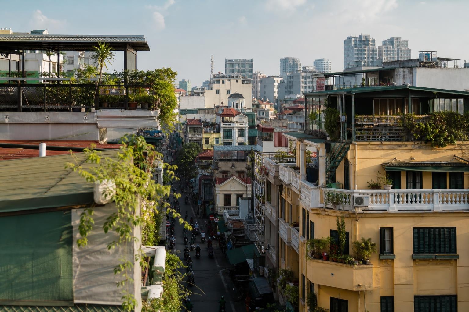 Illustrative elevated view over Hanoi's dense Old Quarter rooftops and a narrow city street.